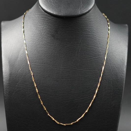 Cadena tipo palito dorada
